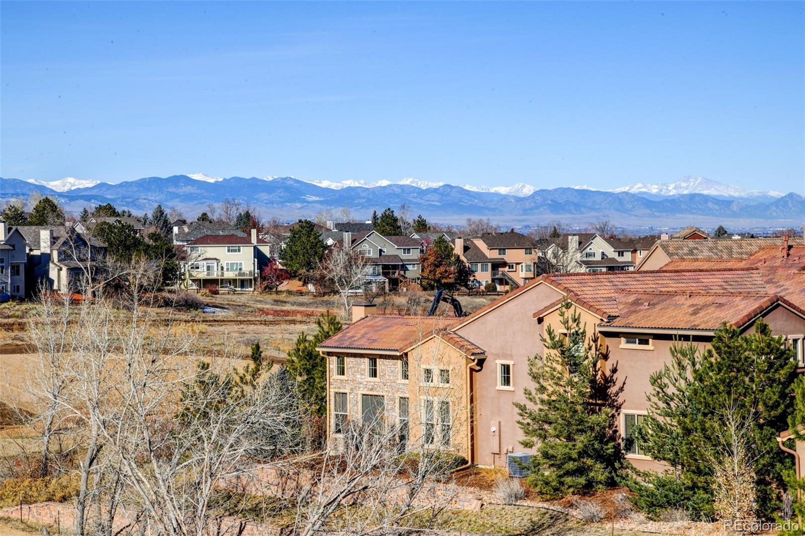 9581 Firenze Way Highlands Ranch, CO 80126 - Photo 7 of 48 a view of a town with mountains in the background