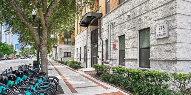 a view of a building with potted plants