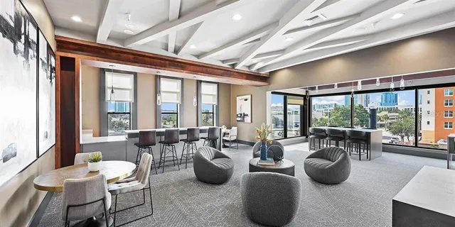 a large dining space with furniture window and outside view