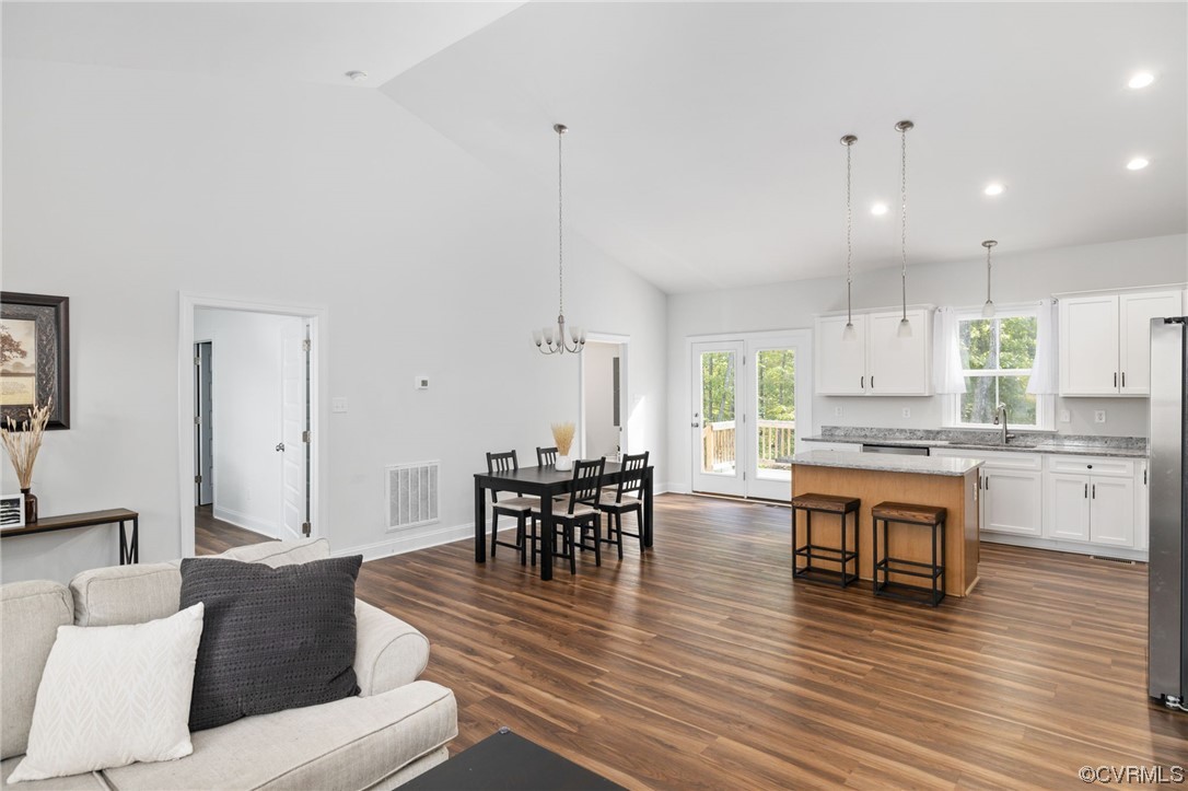 922 Kennon Road Mineral, VA 23117 - Photo 13 of 36 a living room with stainless steel appliances granite countertop wooden floor a dining table and chairs