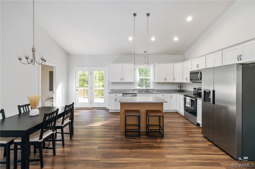 922 Kennon Road Mineral, VA 23117 - Photo 14 of 36 a large kitchen with kitchen island a dining table and chairs