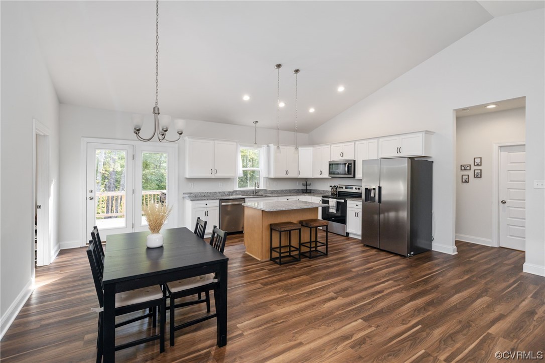 922 Kennon Road Mineral, VA 23117 - Photo 15 of 36 a kitchen with a table chairs refrigerator and cabinets