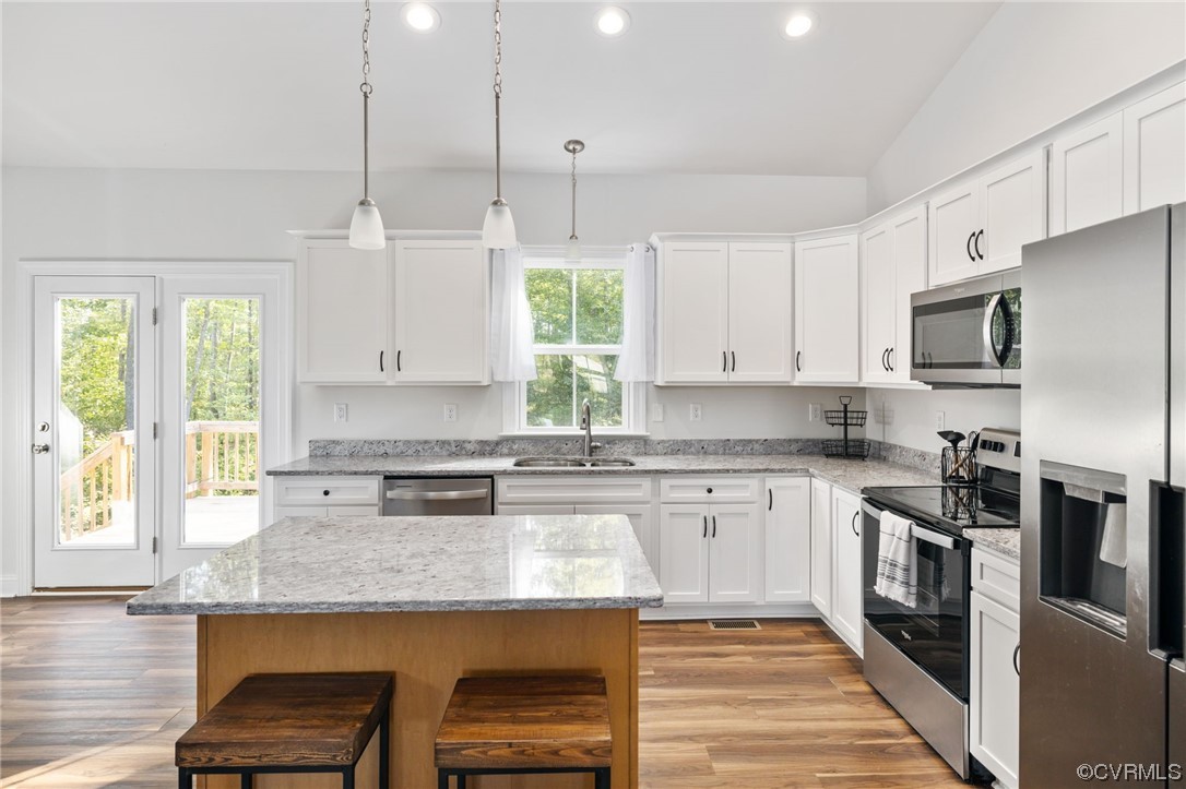 922 Kennon Road Mineral, VA 23117 - Photo 16 of 36 a kitchen with stainless steel appliances granite countertop a stove a sink and a granite counter tops