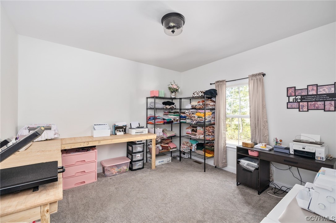 922 Kennon Road Mineral, VA 23117 - Photo 29 of 36 a view of a workspace with furniture and a window