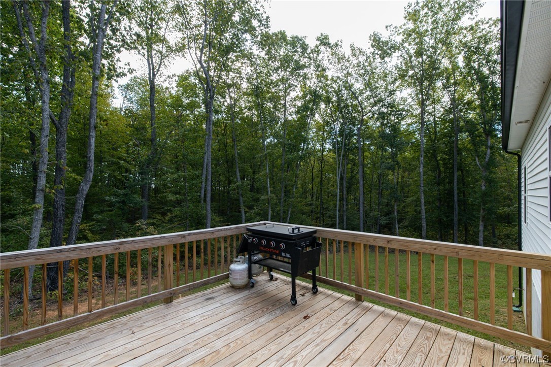 922 Kennon Road Mineral, VA 23117 - Photo 35 of 36 a view of a balcony with wooden floor and fence