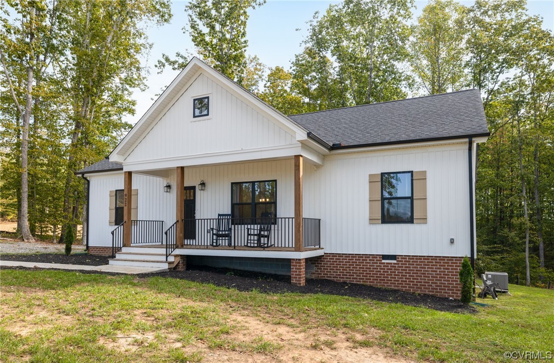 922 Kennon Road Mineral, VA 23117 - Photo 4 of 36 a front view of a house with a yard table and chairs