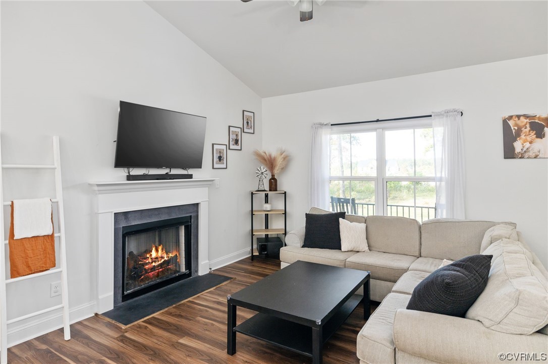 922 Kennon Road Mineral, VA 23117 - Photo 10 of 36 a living room with furniture a flat screen tv and a fireplace