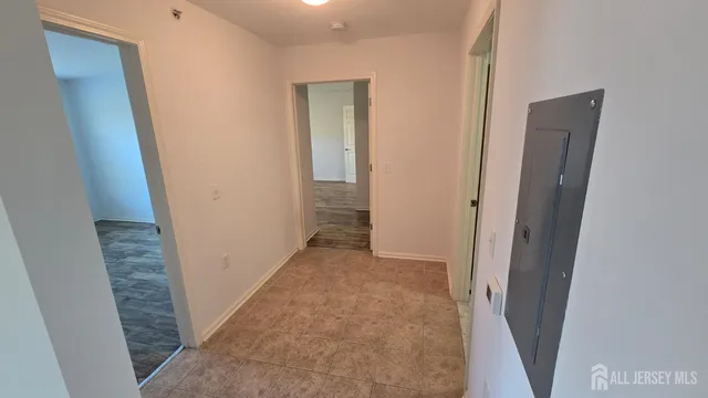 a view of a room with wooden floor and stairs
