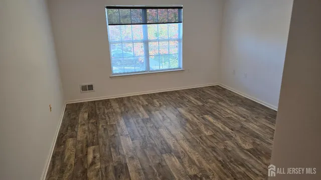 a bed room with furniture and wooden floor