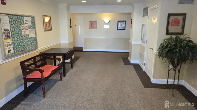 a kitchen with granite countertop a stove a sink and a microwave