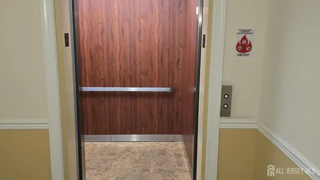 a kitchen with a stove sink and cabinets