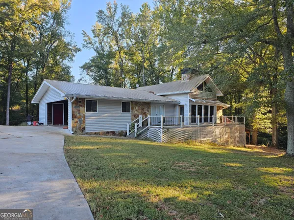 a front view of a house with swimming pool