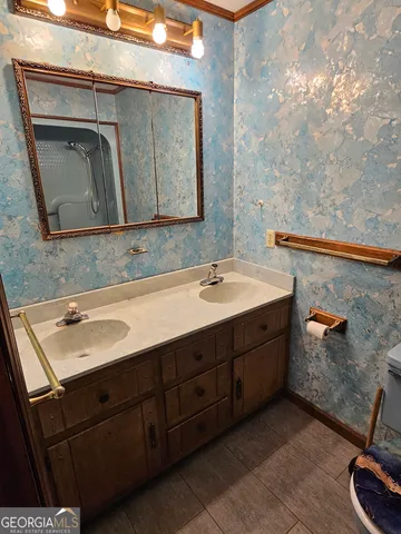 a bathroom with a sink and a mirror