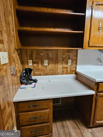 a kitchen with stainless steel appliances a sink and cabinets