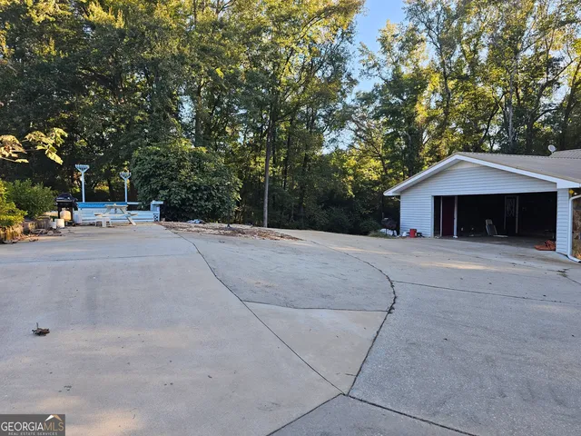 a view of a swimming pool with a patio