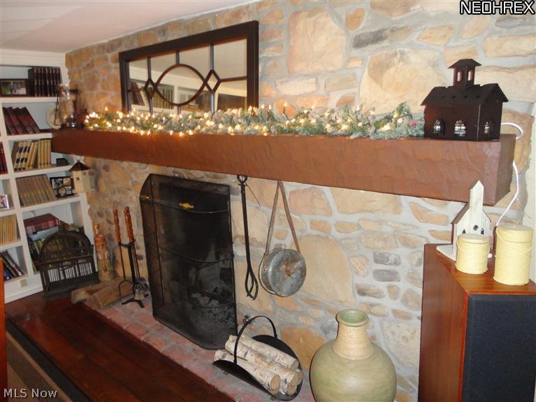 1365 State Road Hinckley, OH 44233 - Photo 5 of 25 Close up view of stone fireplace and brick hearth.