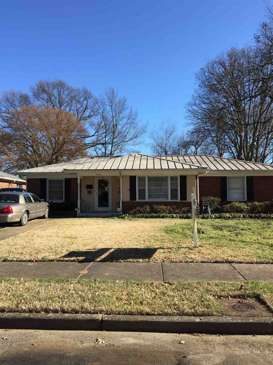 1464 Walton Road Memphis, TN 38117 - Photo 1 of 25 a front view of a house with a yard