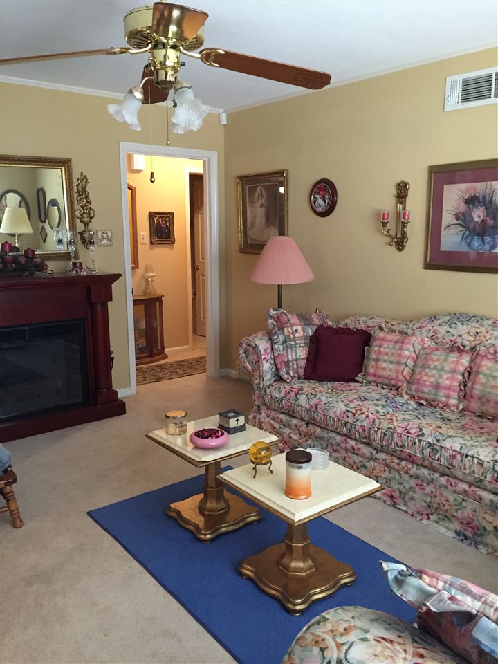 1464 Walton Road Memphis, TN 38117 - Photo 11 of 25 a living room with furniture and a fireplace