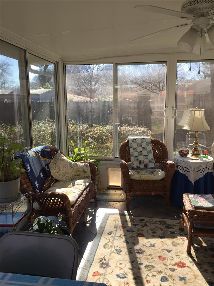 1464 Walton Road Memphis, TN 38117 - Photo 14 of 25 a living room with furniture and a floor to ceiling window