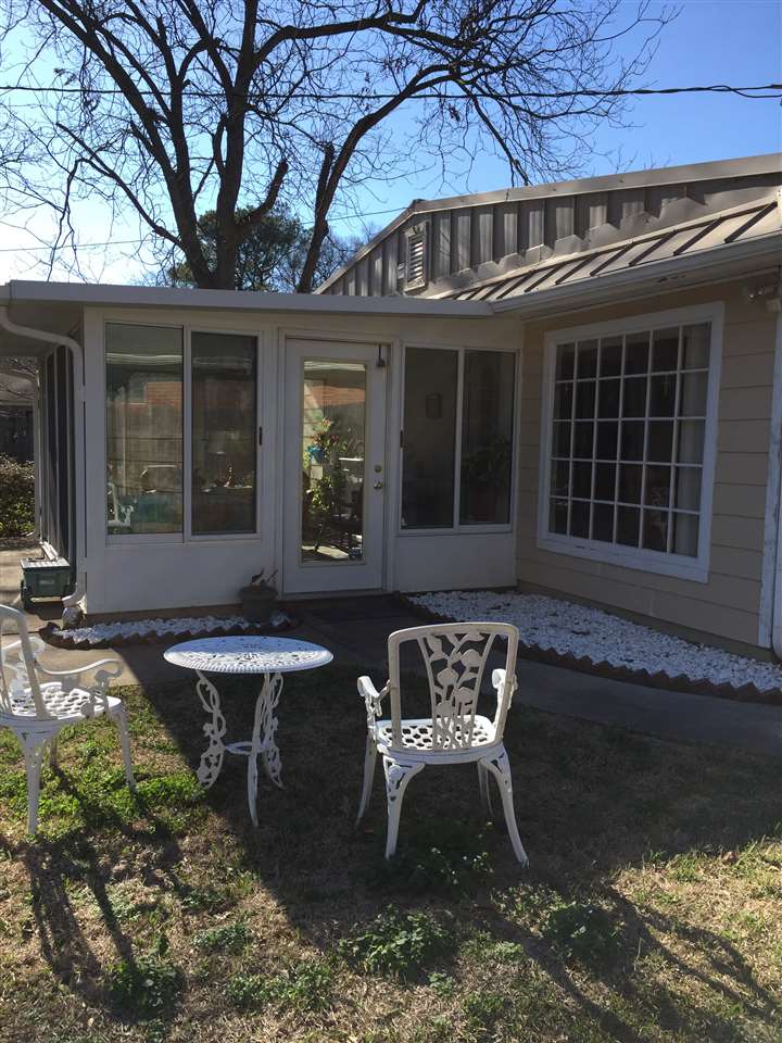 1464 Walton Road Memphis, TN 38117 - Photo 16 of 25 a view of a house with backyard sitting area and sitting area