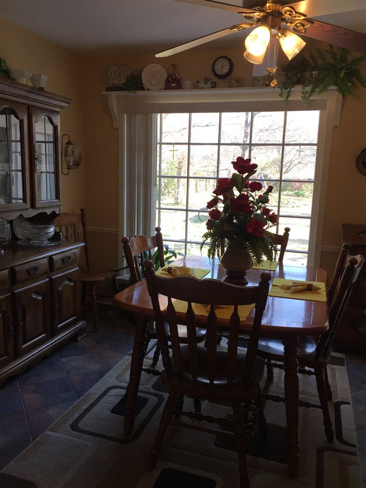 1464 Walton Road Memphis, TN 38117 - Photo 3 of 25 a view of a dining room with furniture and window