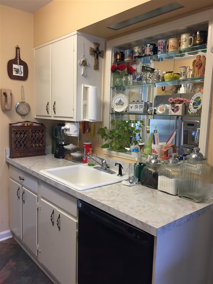 1464 Walton Road Memphis, TN 38117 - Photo 6 of 25 a kitchen with a sink and a refrigerator