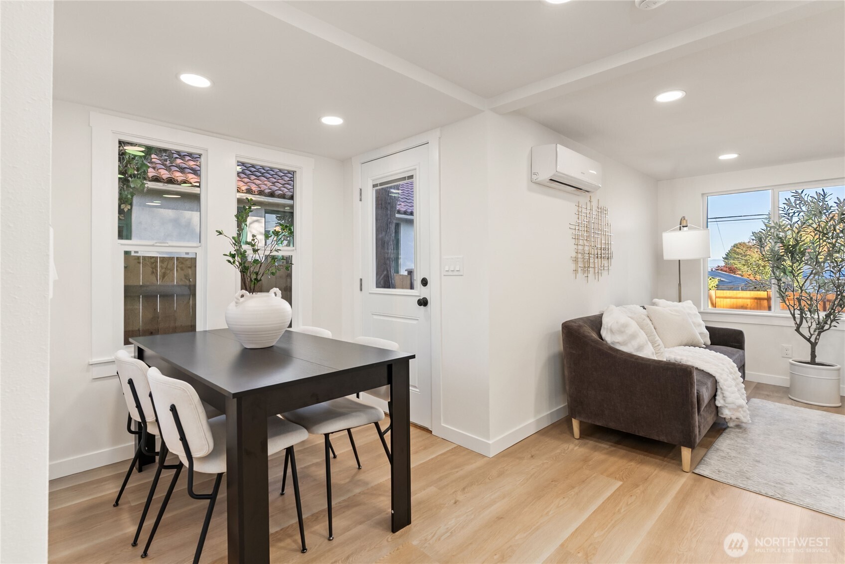 7310 35th Avenue Southwest Seattle, WA 98126 - Photo 12 of 39 a view of a dining room with furniture and wooden floor