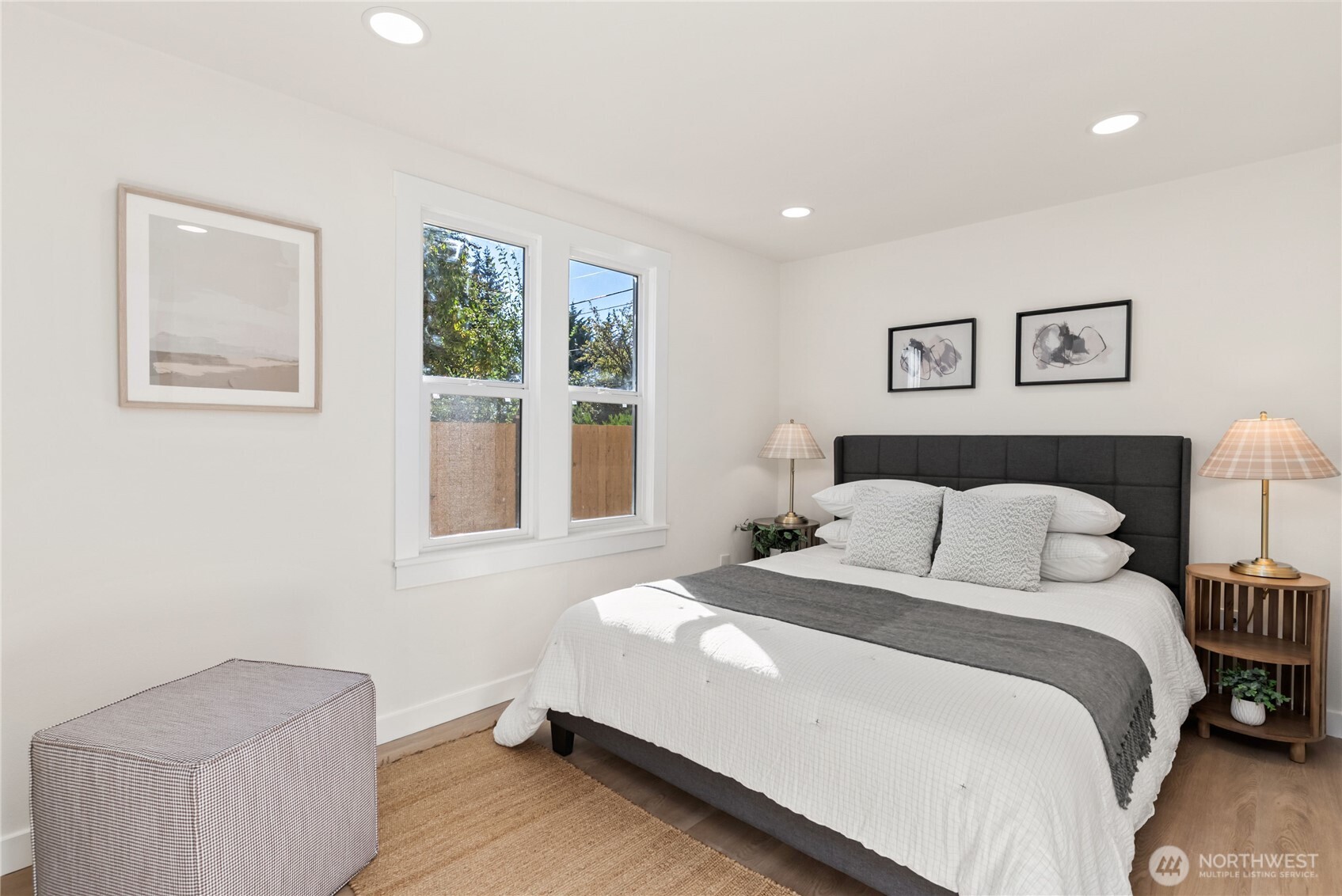 7310 35th Avenue Southwest Seattle, WA 98126 - Photo 18 of 39 a bedroom with a bed and a painting on the wall