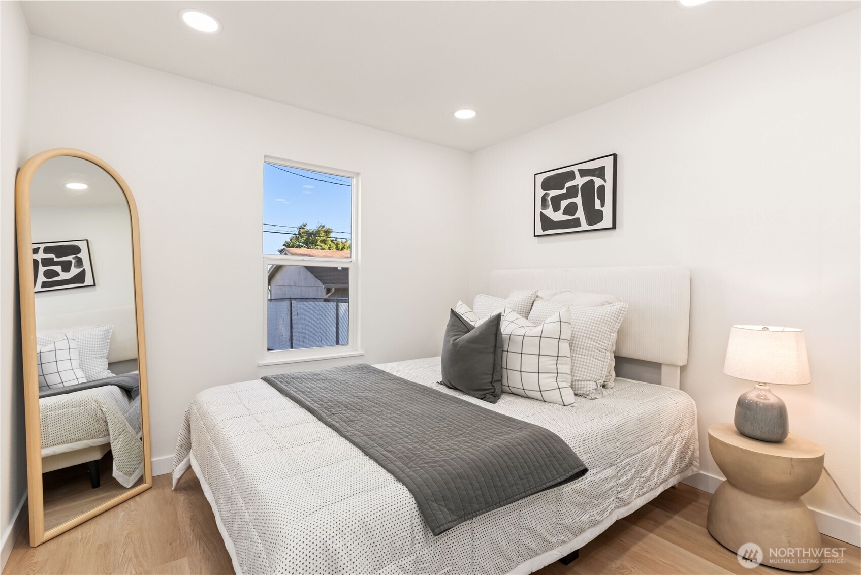 7310 35th Avenue Southwest Seattle, WA 98126 - Photo 19 of 39 a bedroom with a bed and a couch