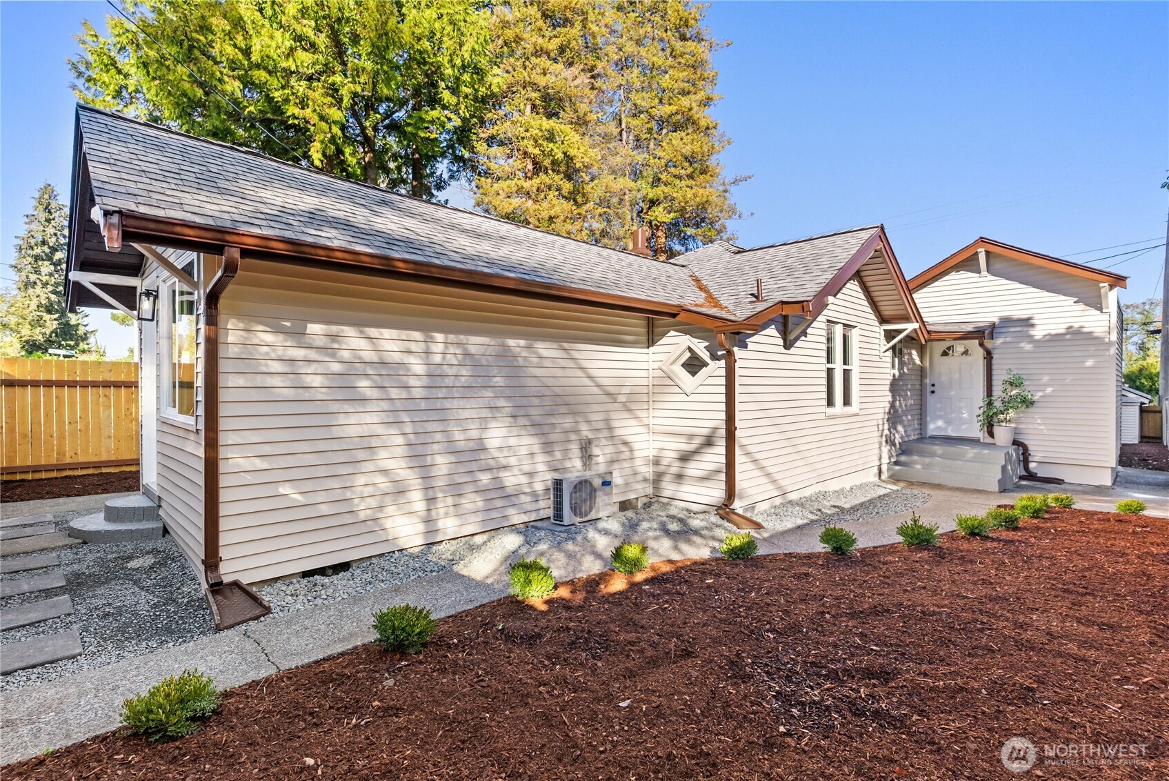 7310 35th Avenue Southwest Seattle, WA 98126 - Photo 2 of 39 a view of a small house with yard and sitting area