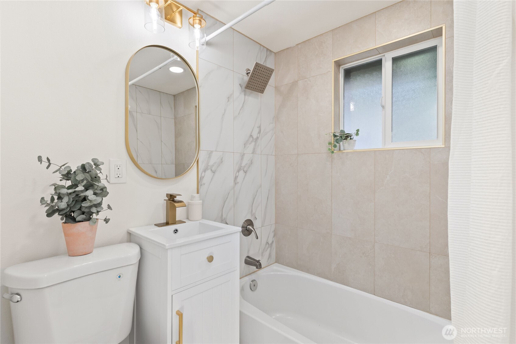 7310 35th Avenue Southwest Seattle, WA 98126 - Photo 21 of 39 a bathroom with a sink toilet and shower