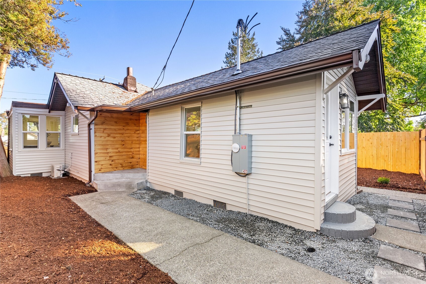 7310 35th Avenue Southwest Seattle, WA 98126 - Photo 22 of 39 a view of a house with a yard