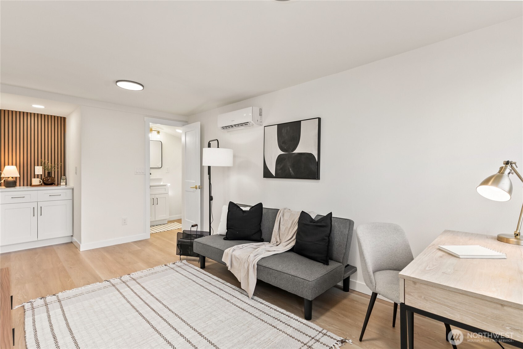 7310 35th Avenue Southwest Seattle, WA 98126 - Photo 24 of 39 a living room with furniture and a wooden floor