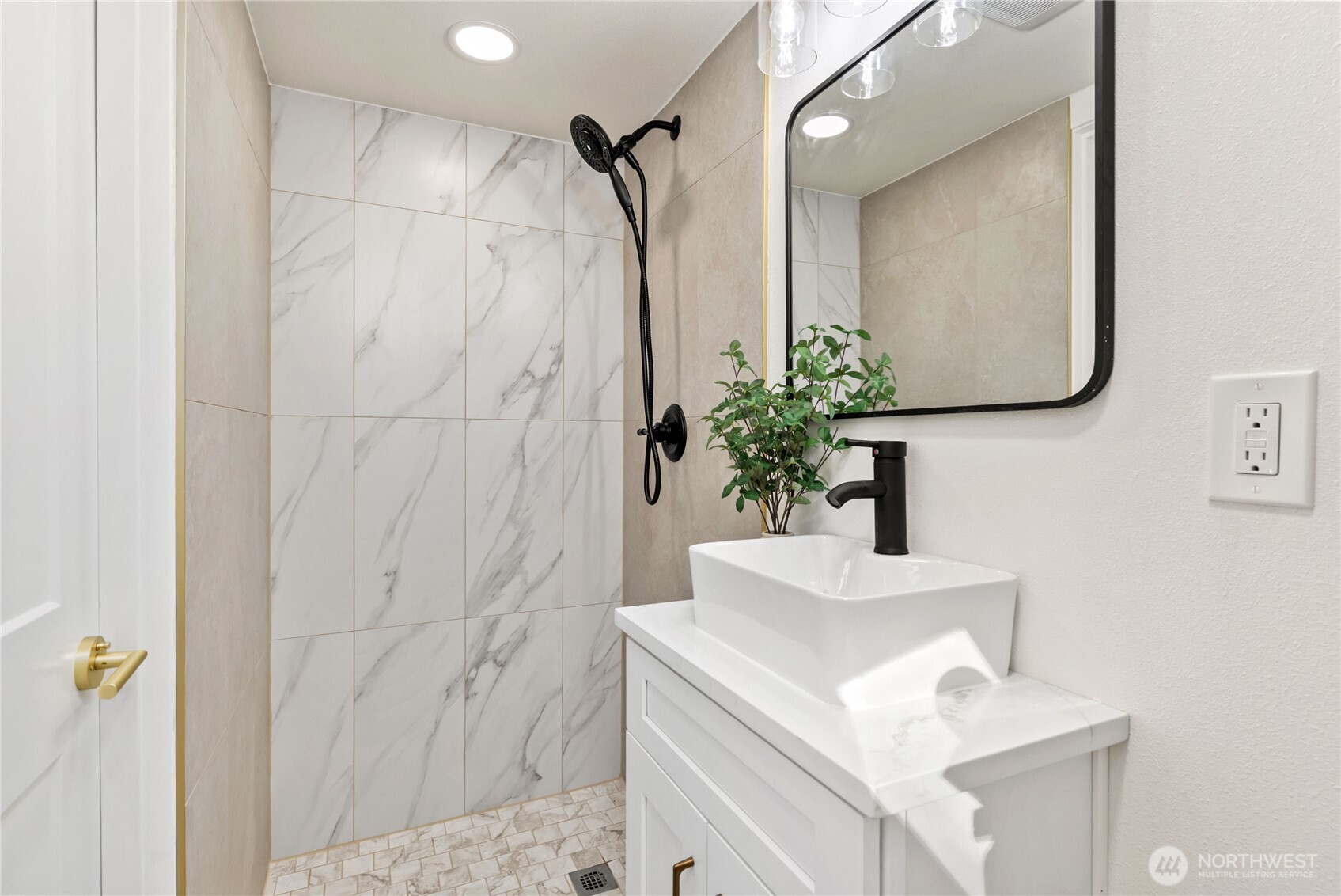 7310 35th Avenue Southwest Seattle, WA 98126 - Photo 28 of 39 a bathroom with a sink vanity and a mirror
