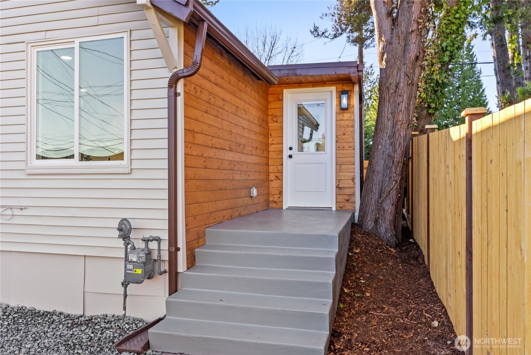 7310 35th Avenue Southwest Seattle, WA 98126 - Photo 4 of 39 a view of a house with a door and wooden floor