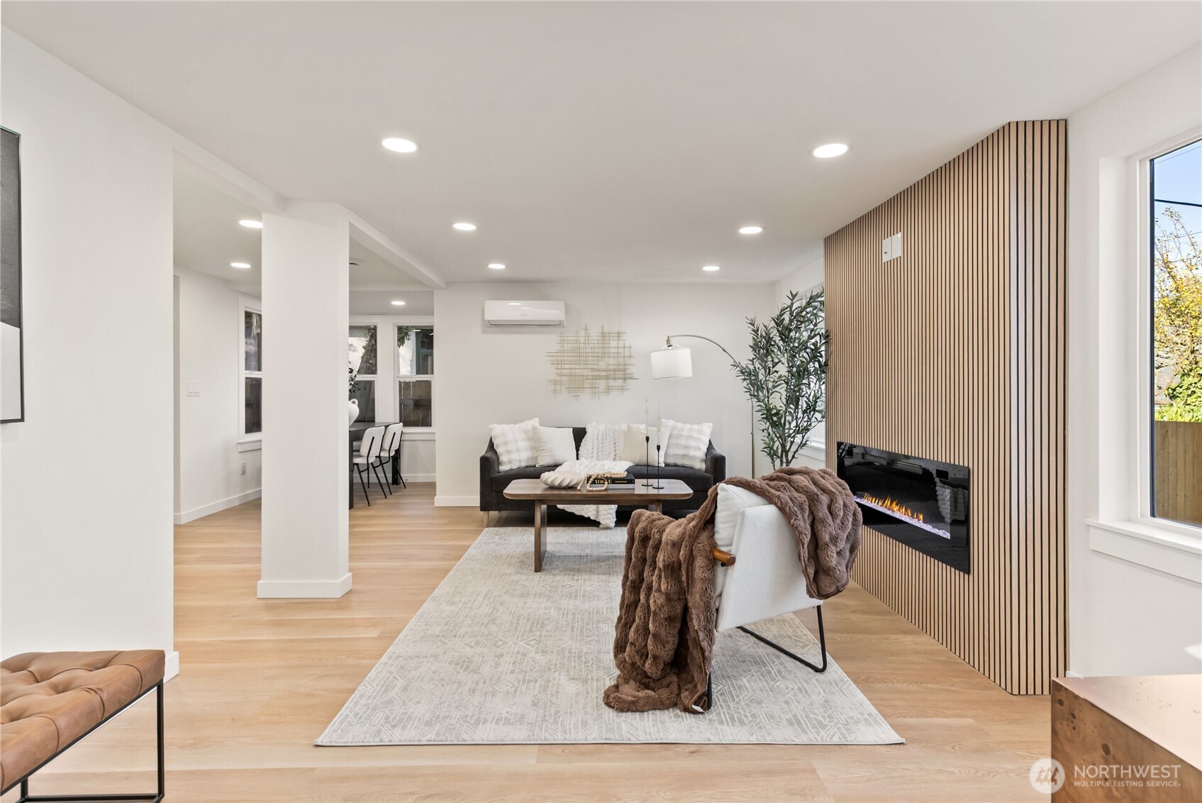 7310 35th Avenue Southwest Seattle, WA 98126 - Photo 6 of 39 a living room with furniture a rug and a fireplace