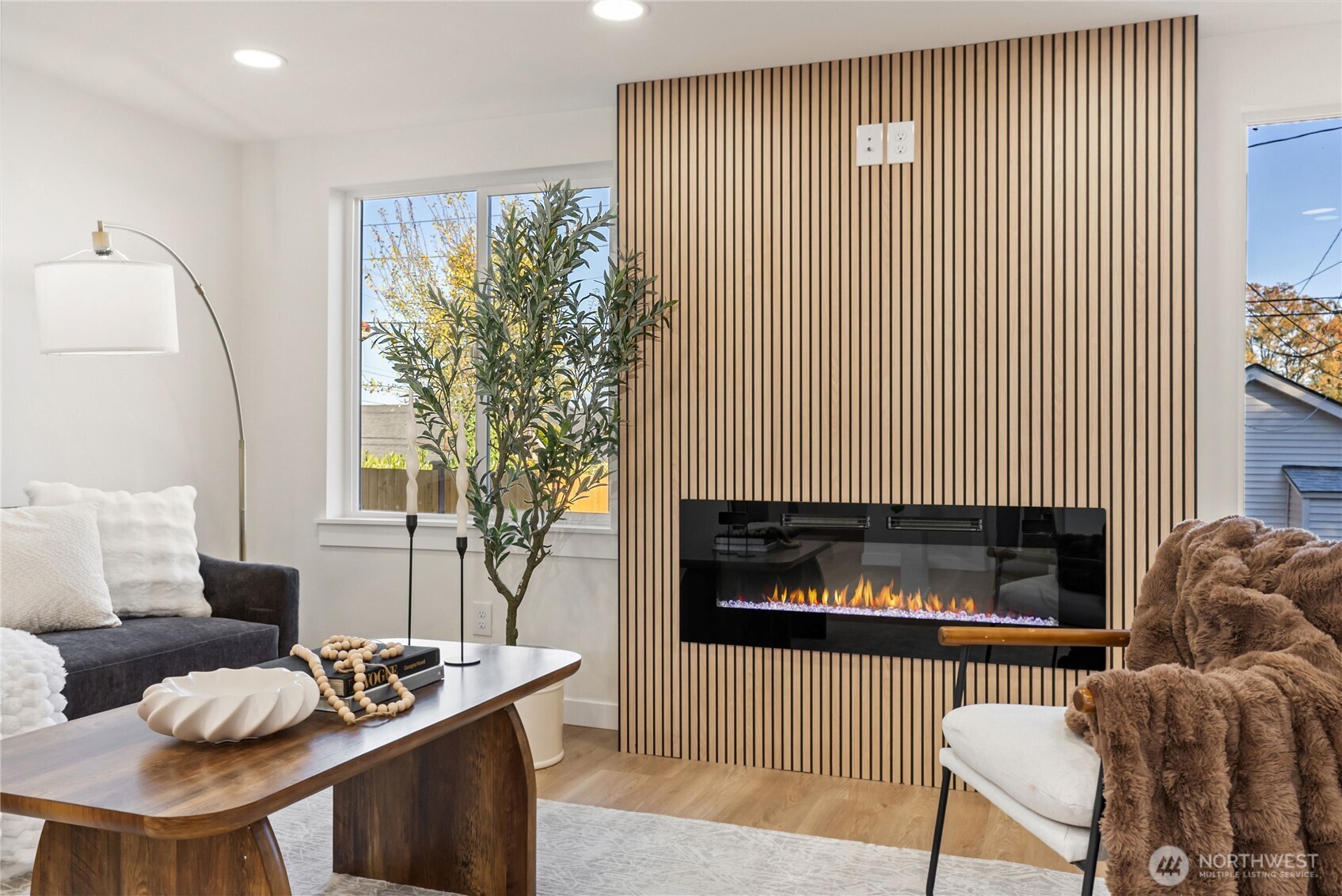 7310 35th Avenue Southwest Seattle, WA 98126 - Photo 8 of 39 a living room with furniture and a fireplace