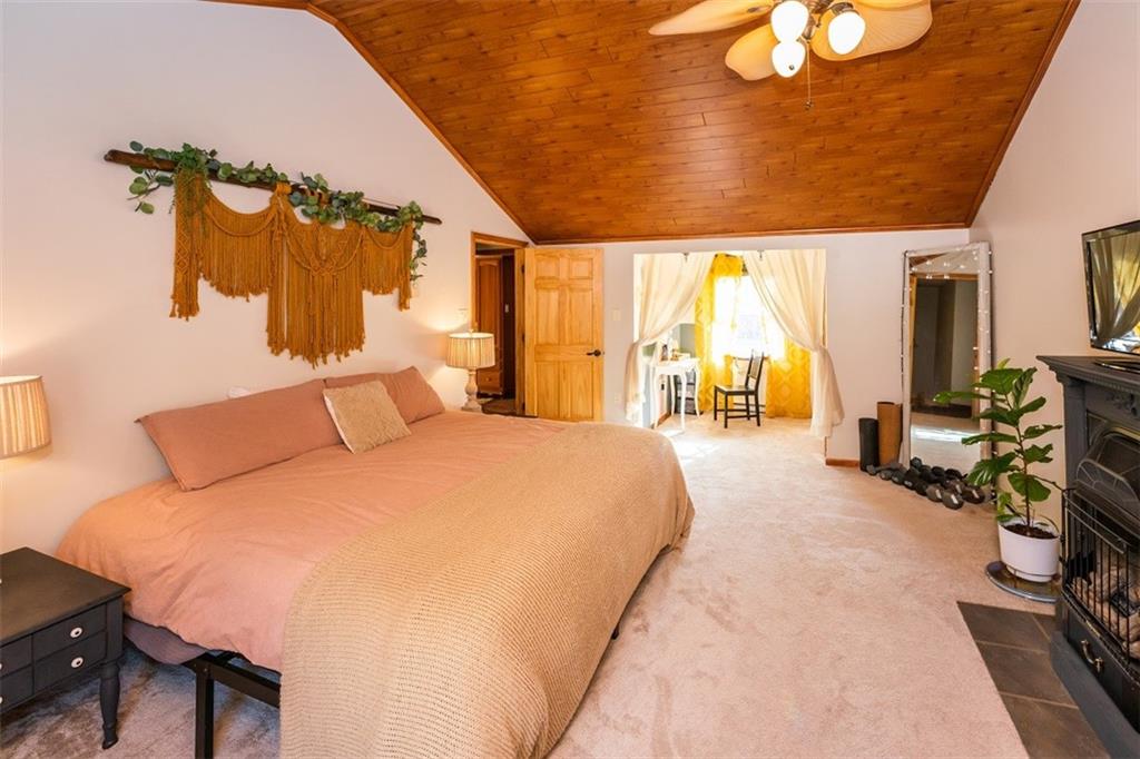 232 Lighthouse Road Commodore, PA 15729 - Photo 12 of 17 a spacious bedroom with a bed a table and chair