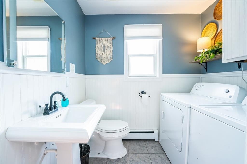 232 Lighthouse Road Commodore, PA 15729 - Photo 8 of 17 a bathroom with a toilet sink and mirror