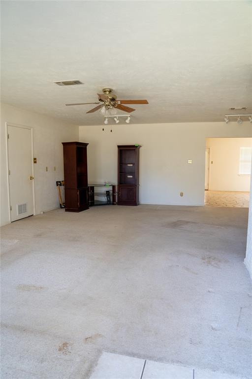 156 Wayman Drive Whitney, TX 76692 - Photo 12 of 17 a view of a big room with closet and windows