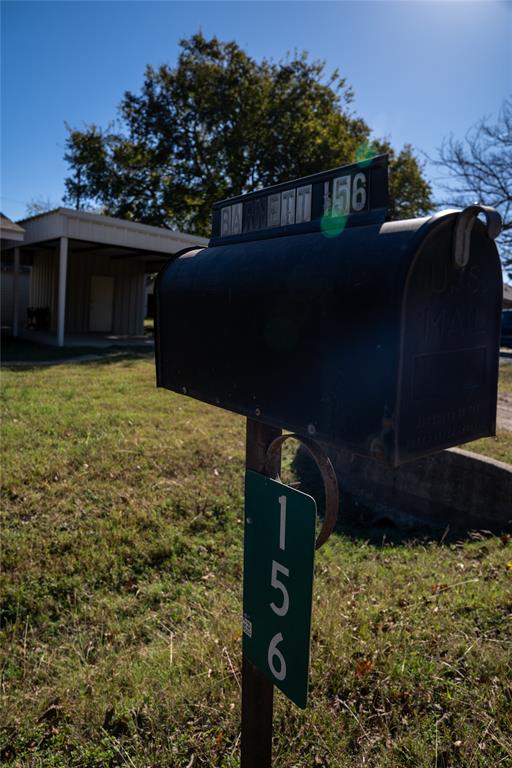 156 Wayman Drive Whitney, TX 76692 - Photo 18 of 20 a front view of a house with a yard