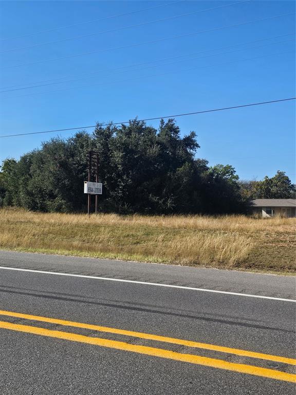 156 Wayman Drive Whitney, TX 76692 - Photo 9 of 20 a view of swimming pool with a yard and ocean view