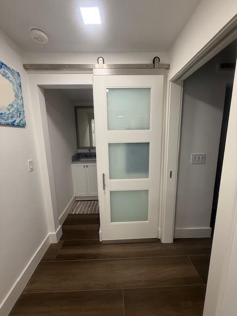 5520 North Ocean Boulevard, Unit 111 Ocean Ridge, FL 33435 - Photo 15 of 53 half bath frosted glass barn door