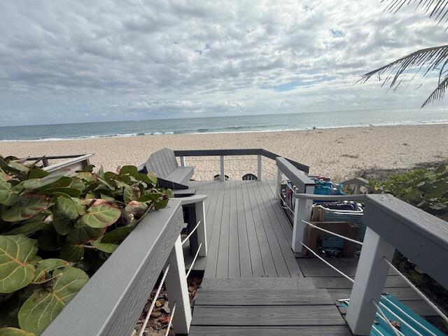 5520 North Ocean Boulevard, Unit 111 Ocean Ridge, FL 33435 - Photo 48 of 63 a view of a roof deck with chair and wooden floor