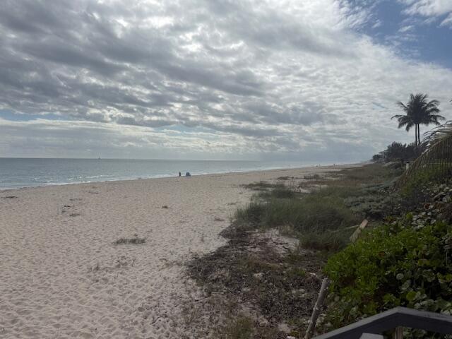 5520 North Ocean Boulevard, Unit 111 Ocean Ridge, FL 33435 - Photo 55 of 63 a view of a dry yard with wooden fence