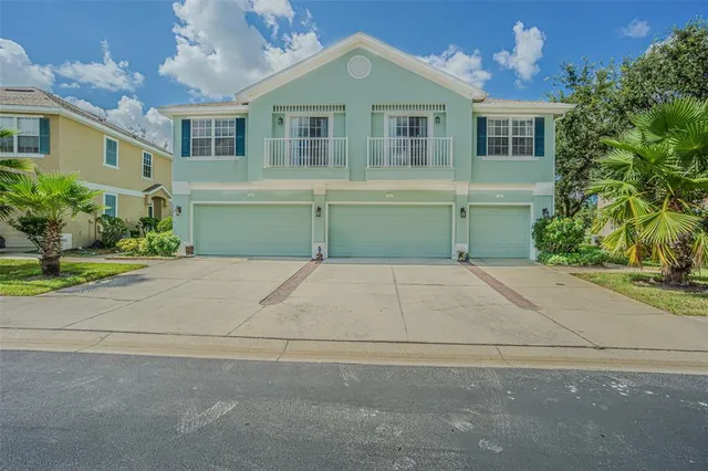a front view of a house with a garage
