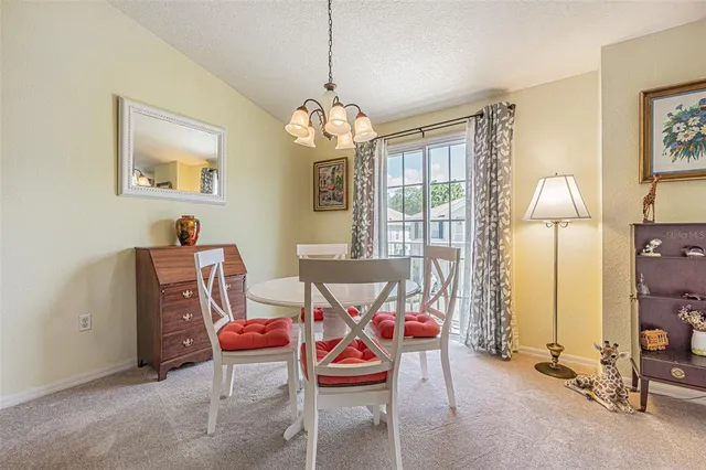 a dining room with furniture and window