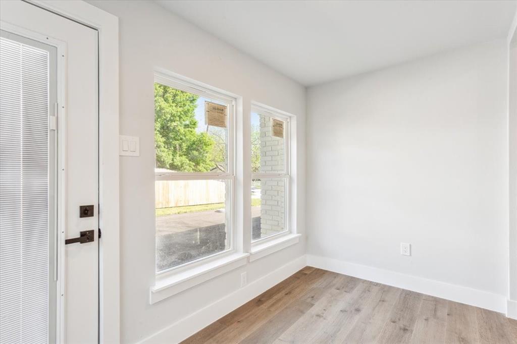 900 North 22nd Street Waco, TX 76707 - Photo 15 of 37 a view of an empty room with wooden floor and a window