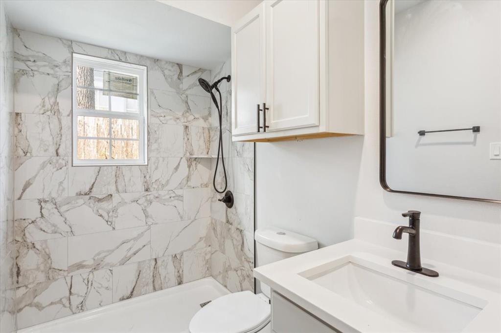900 North 22nd Street Waco, TX 76707 - Photo 23 of 37 a bathroom with a sink toilet and shower
