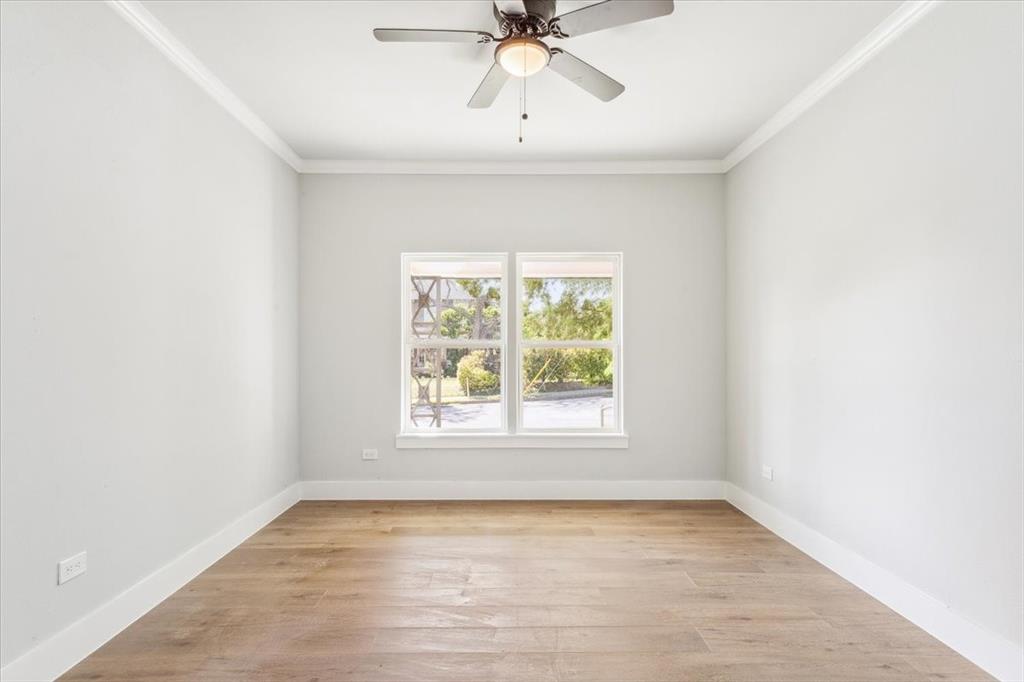 900 North 22nd Street Waco, TX 76707 - Photo 25 of 37 an empty room with a window and a fan